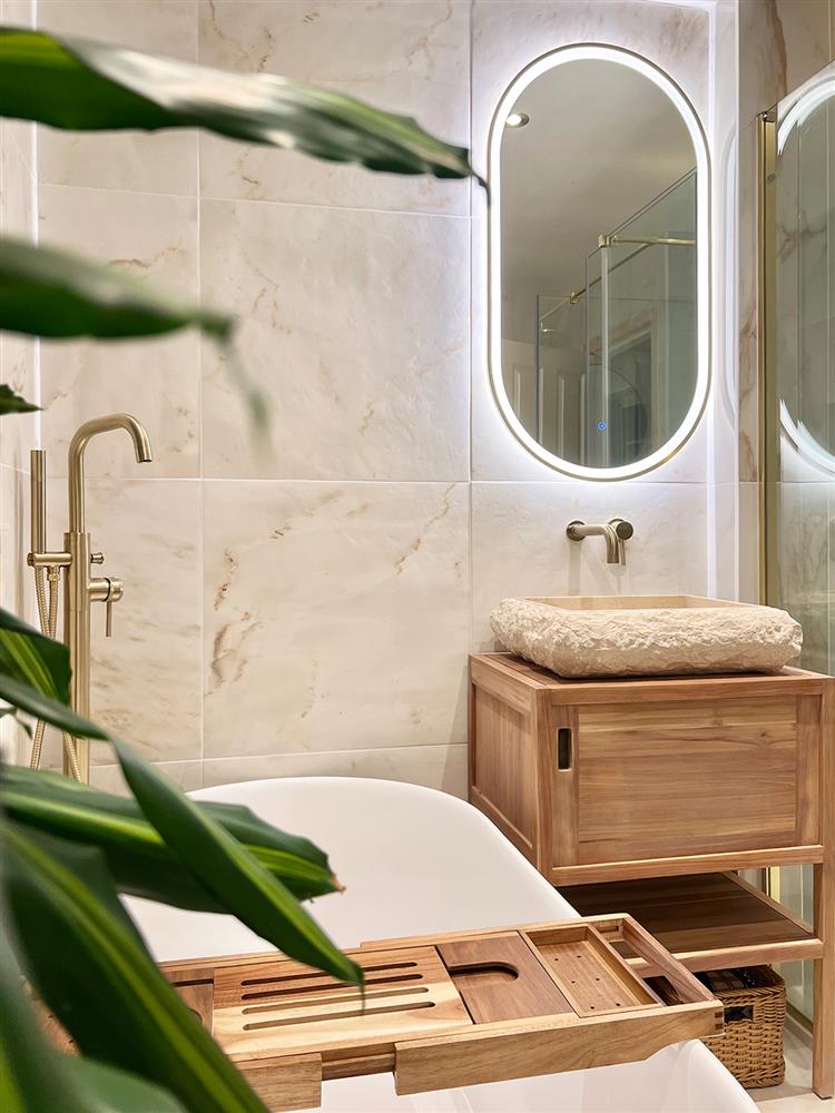 Calacatta amber marble porcelain tiles in a hotel spa inspired bathroom